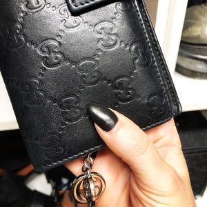 Guccisma black large wallet w/silver GG charm.